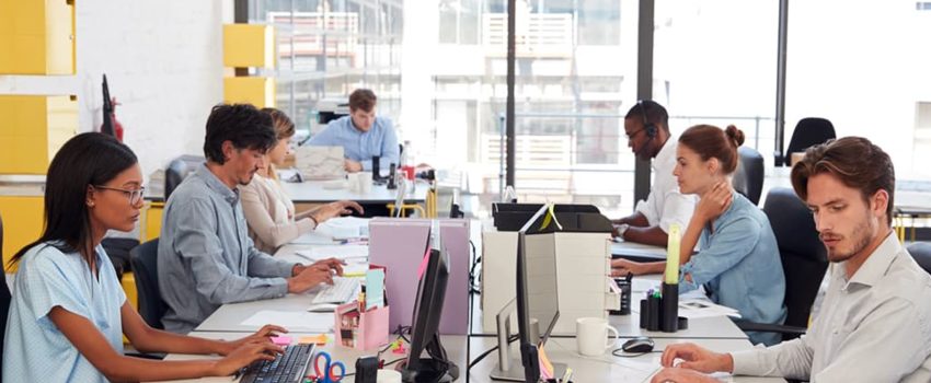 workers in an open plan work space